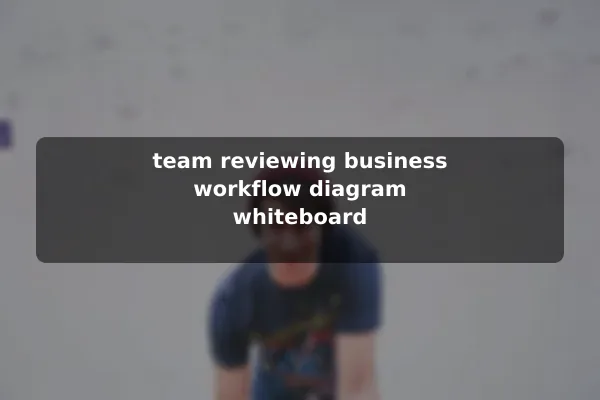 team reviewing business workflow diagram whiteboard
